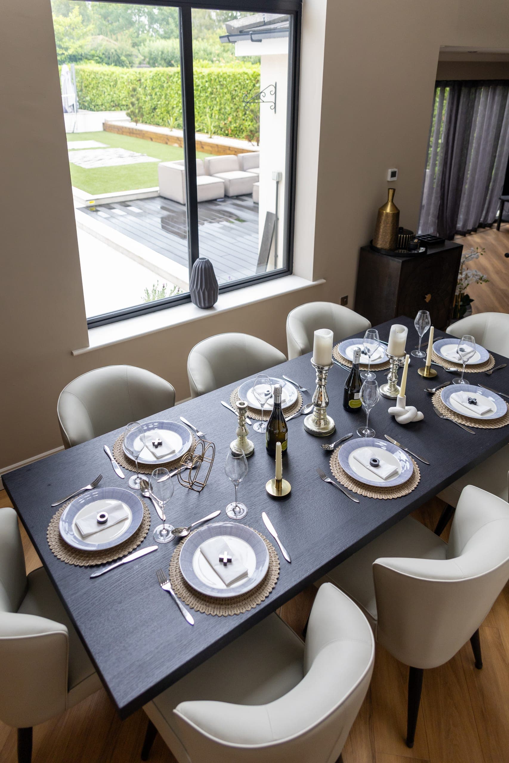 The dining table laid for dinner