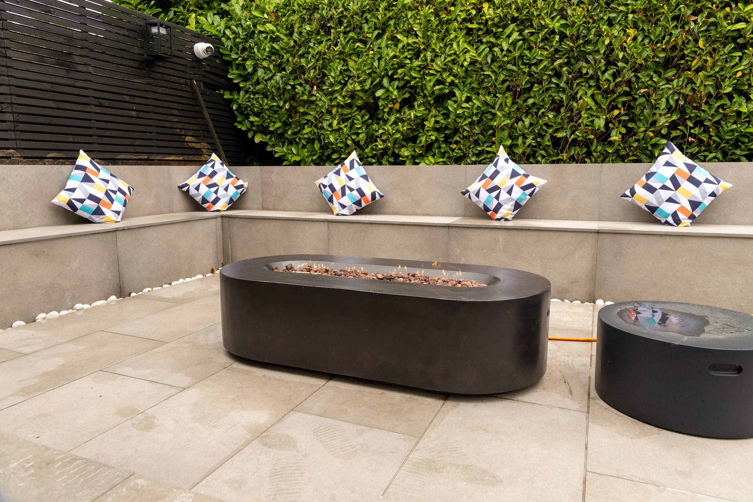 The firepit terrace with its cushioned benches