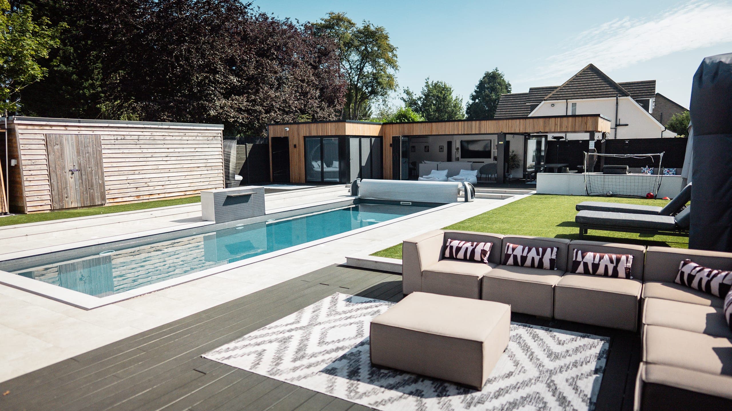 The heated outdoor pool, with the poolside villa and lounge terrace beyond